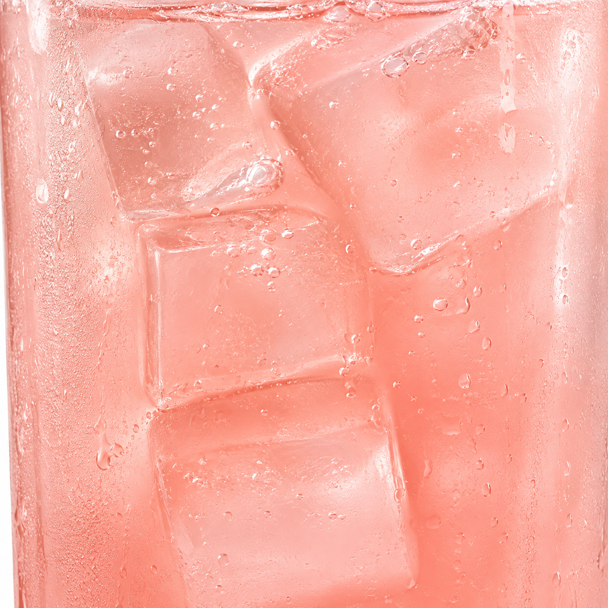Pink drink over ice in a glass, a liquid L-carnitine serving mixed into water