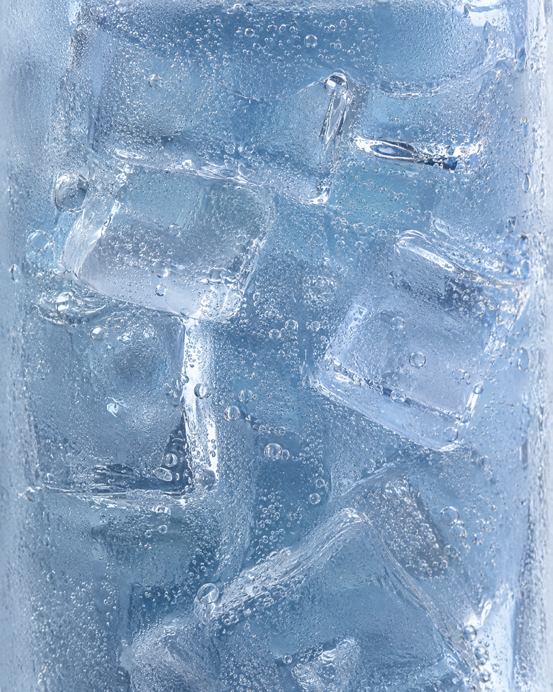 A close-up of translucent ice cubes inside a clear glass container, showing blue-tinted water and small air bubbles.